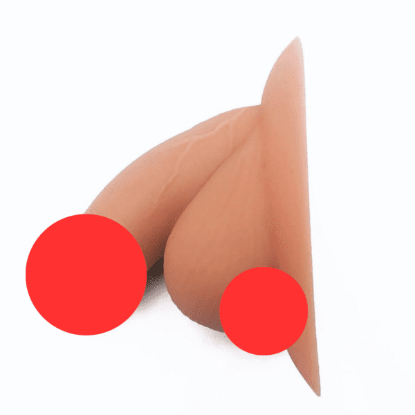 A realistic silicone prosthetic device featuring male genitalia, shown from the side. The Soft Packer, made of a soft, flesh-toned material, mimics a Caucasian complexion. Red circles have been placed over the image to cover sensitive areas. The background is plain white.